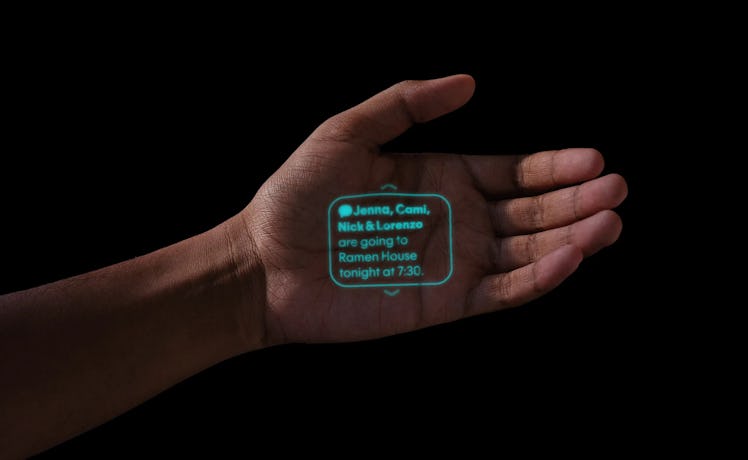 A text message interface being projected by the Ai Pin's projector on a hand.