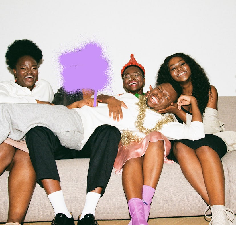 four friends hanging out at a holiday party