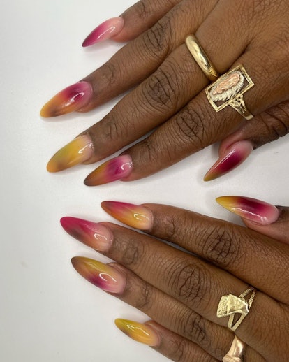 Warm-toned watercolor nails are on-trend for Thanksgiving nail design for 2023.