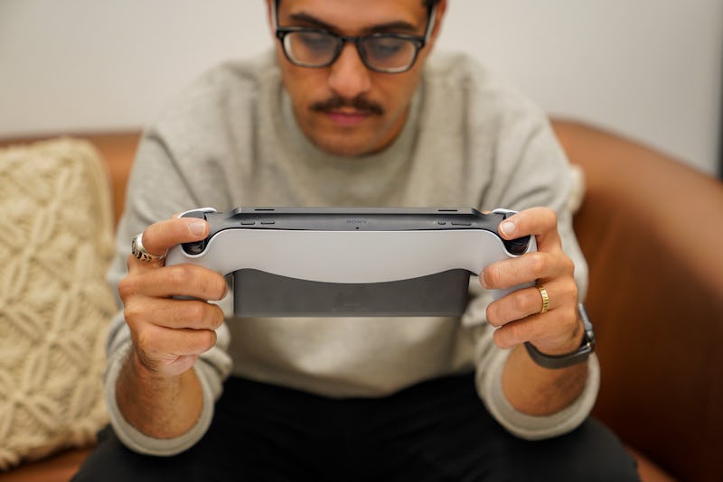 A man playing with the Sony PlayStation Portal