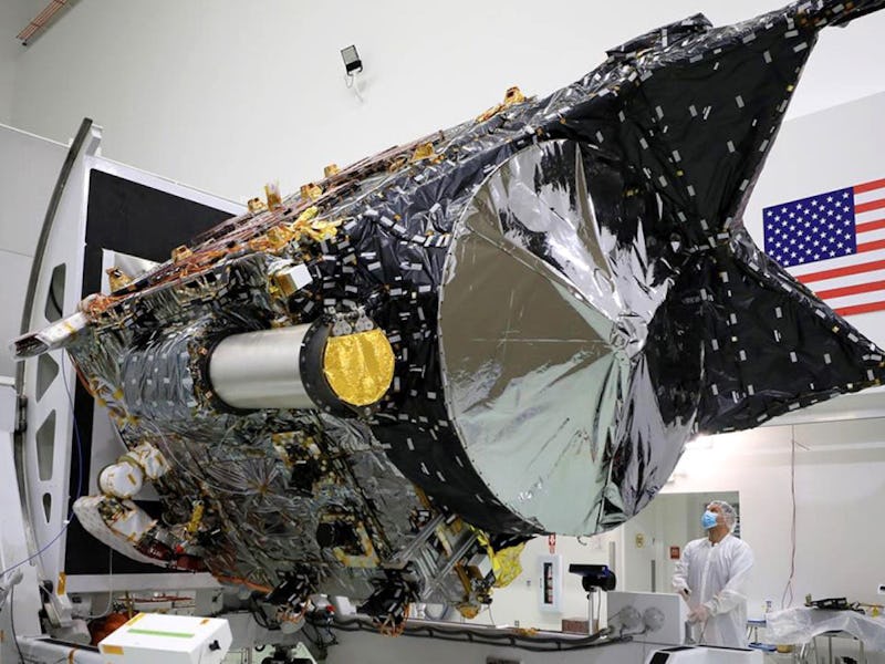 Workers at a facility near Florida’s Kennedy Space Center attend to NASA’s Psyche spacecraft in late...