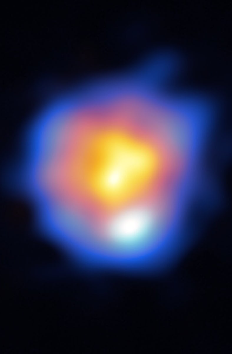 a star in shades of orange, surrounded by blue gas, on a black background