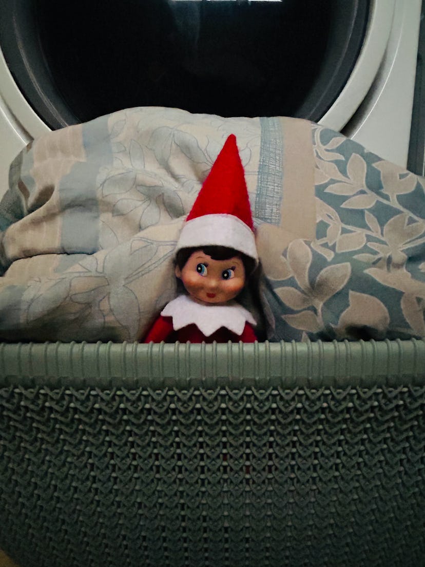 elf on the shelf helping with the laundry