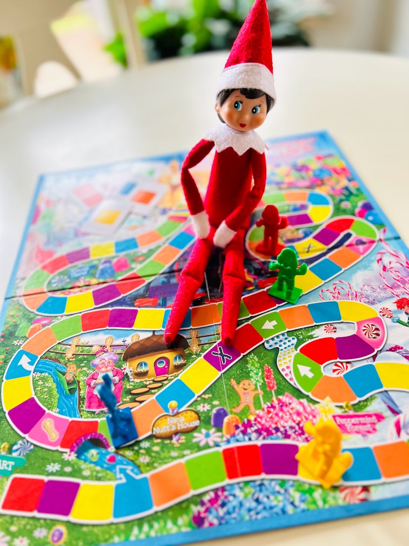 elf on the shelf playing candy land