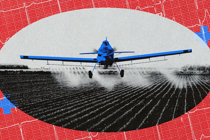 A plane spraying insecticides on a field of crops.