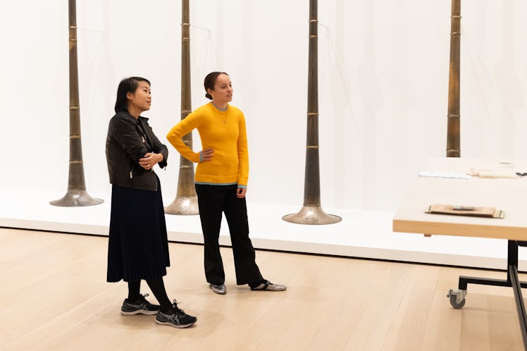 MoMA curator Michelle Kuo and Grace Wales Bonner stand in front of Terry Adkins’s Last Trumpet, 1995...