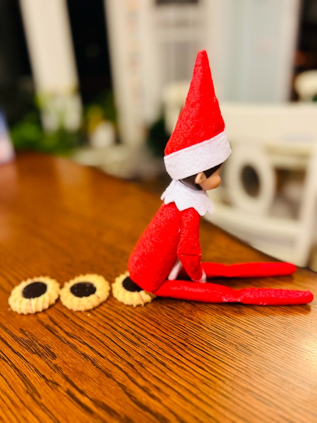 elf on the shelf lying on a cookie