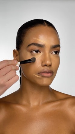 Makeup By Mario model demoing concealer
