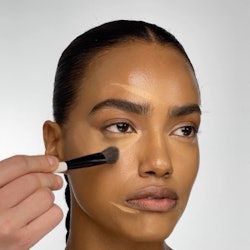Makeup By Mario model demoing concealer