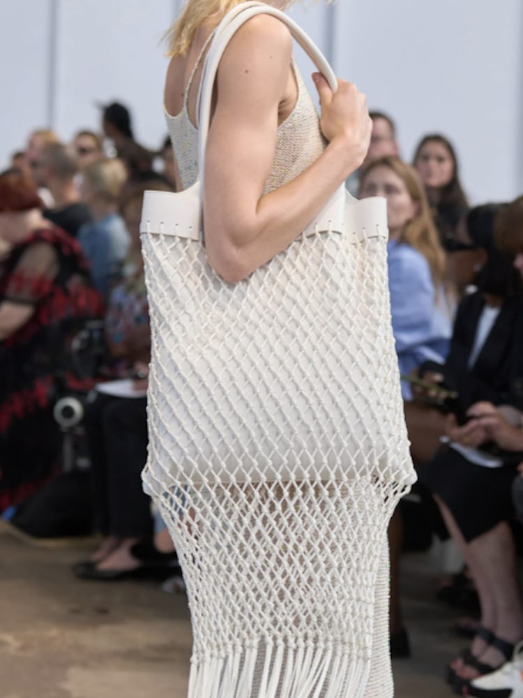a model carrying a Gabriela Hearst handbag
