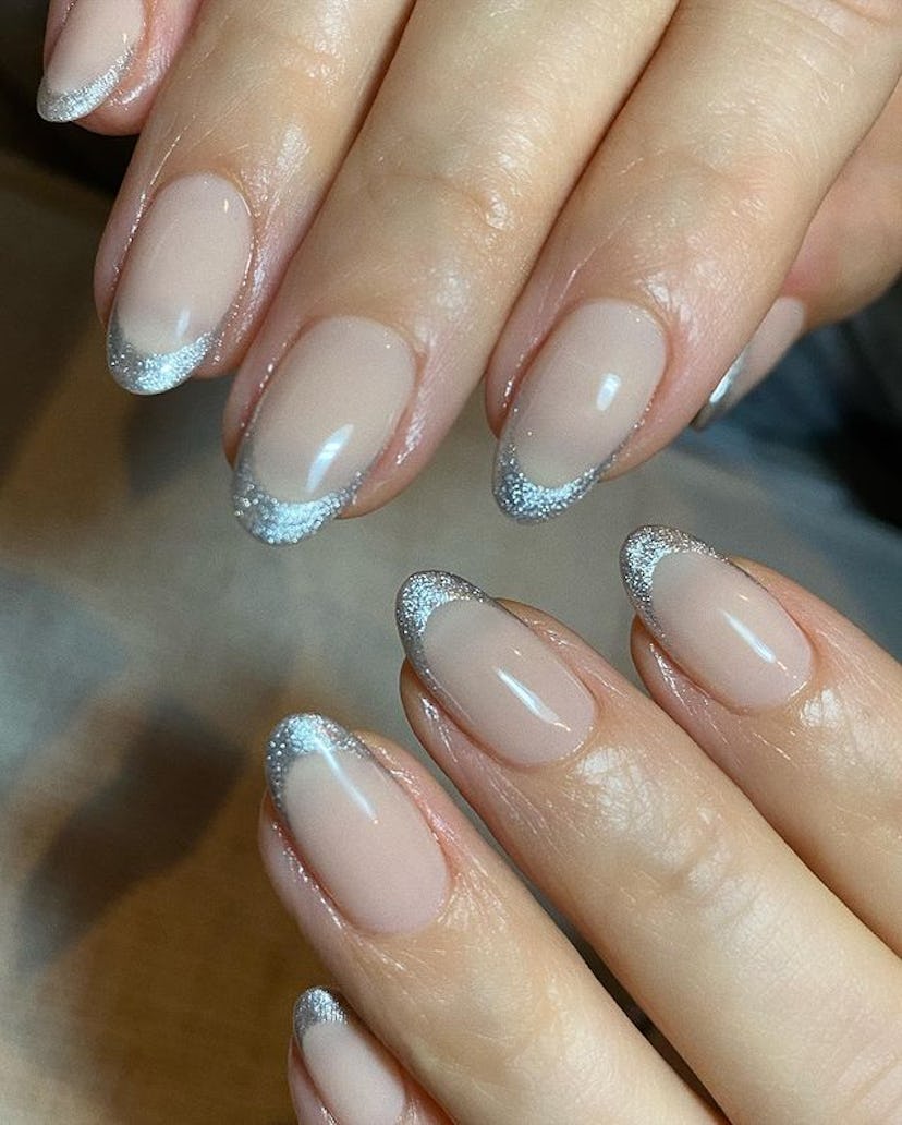 Kourtney Kardashian silver glitter French tips on natural oval nails
