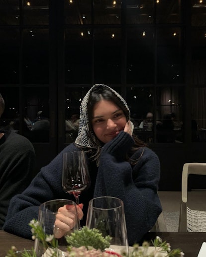 Kendall Jenner wears a head scarf.