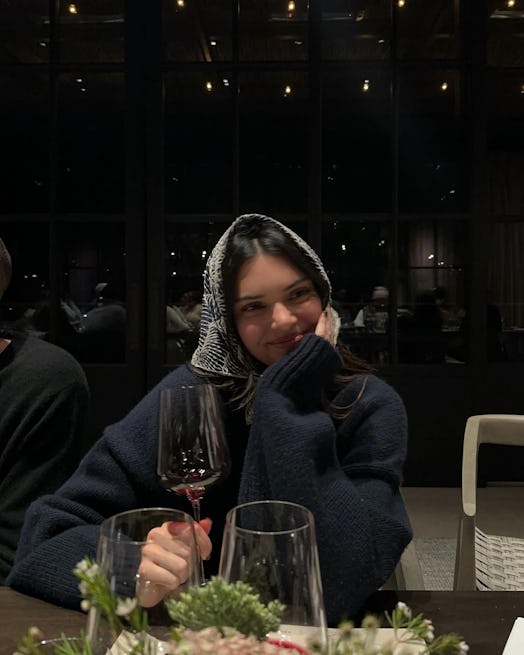 Kendall Jenner wears a head scarf.