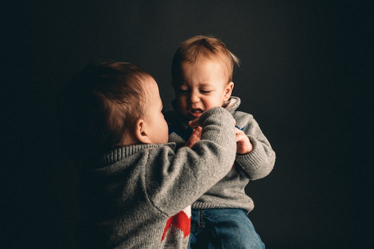 Toddlers hitting each other.