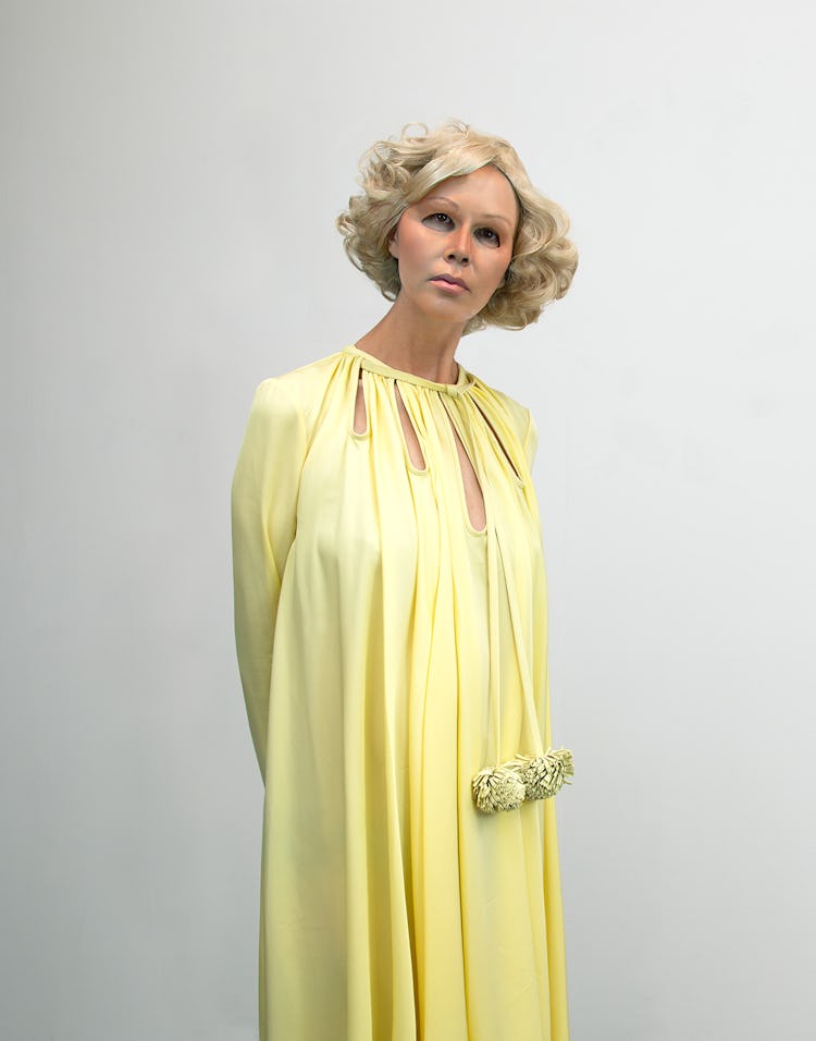 Artist Gillian Wearing wears a yellow silk dress.