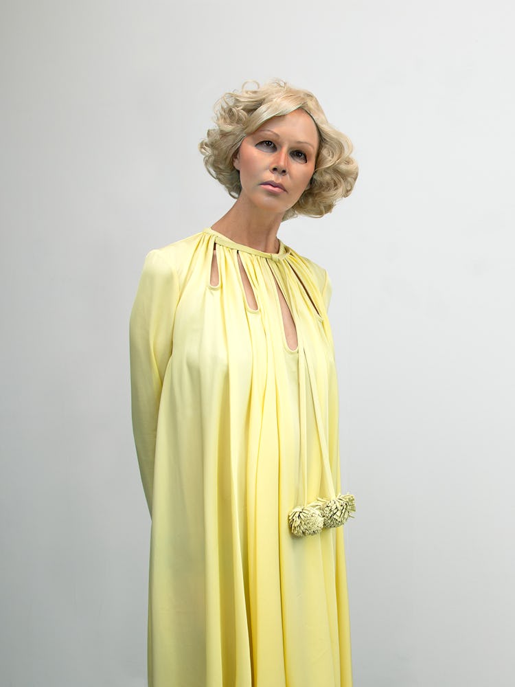 Artist Gillian Wearing wears a yellow silk dress.