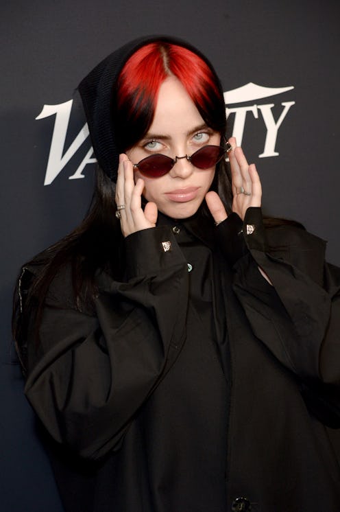 billie eilish wears all black and a headscarf