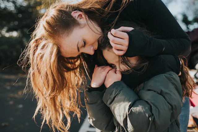 A mom comforts her young daughter, who is scared.