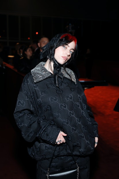 Billie Eilish wears a Gucci jacket and headscarf
