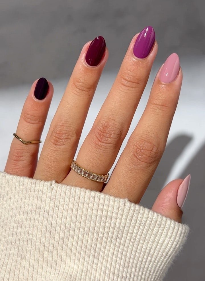 Purple Skittle nails are an on-trend nail design idea for Sagittarius season 2023.