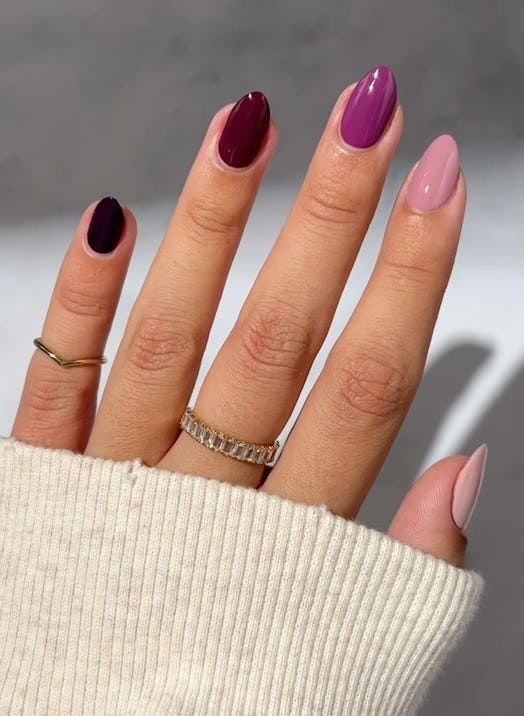Purple Skittle nails are an on-trend nail design idea for Sagittarius season 2023.