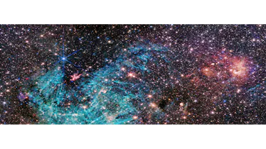 In a field crowded with stars, a funnel-shaped region of space appears darker than its surroundings ...