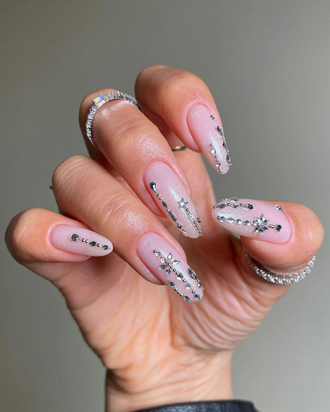 Bedazzled winter-themed nails are on-trend for Sagittarius season 2023.