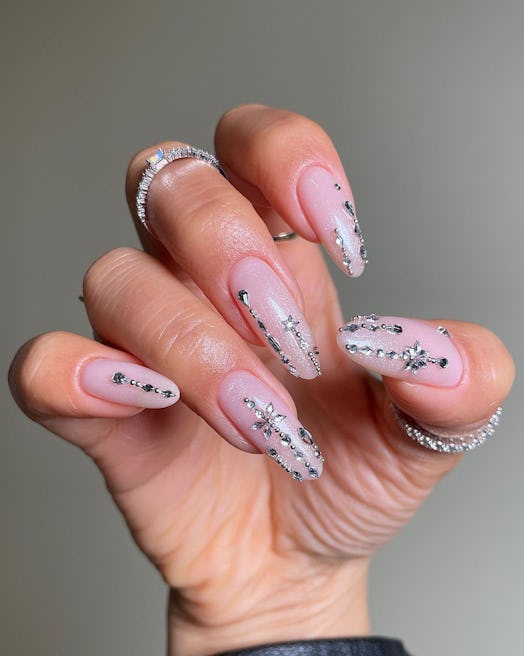 Bedazzled winter-themed nails are on-trend for Sagittarius season 2023.