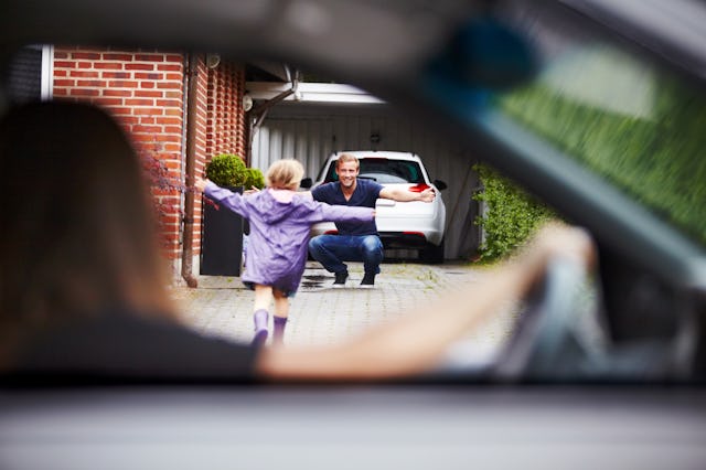A mother drops her child off at her ex-husband's house.