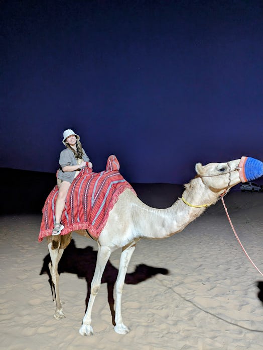 Kaitlin Cubria on a camel in Abu Dhabi.
