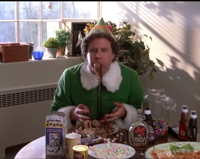 movie flip of buddy the elf from elf making spaghetti with maple syrup, chocolate, and candy
