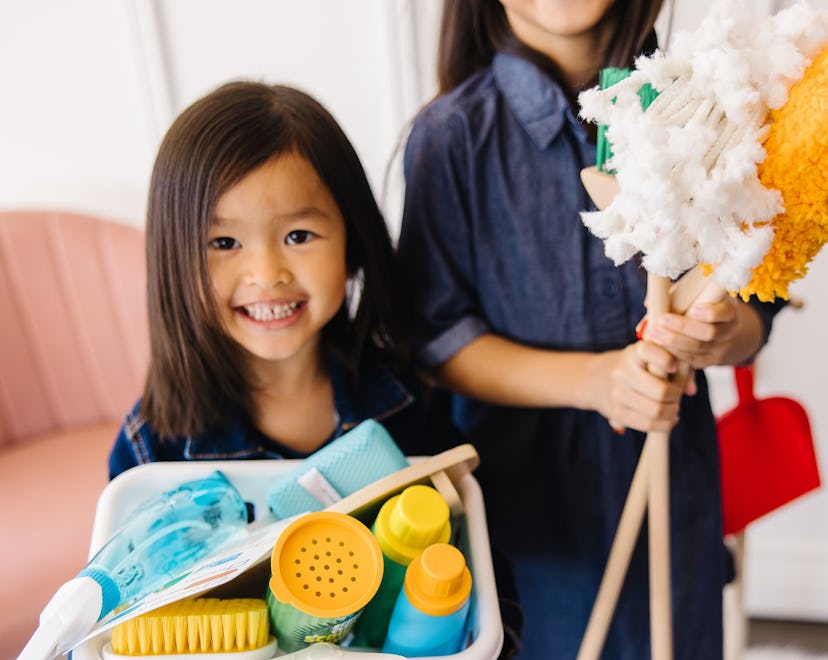 Little kids show off their cleaning toys in a round up of the best toddler cleaning toys 2023