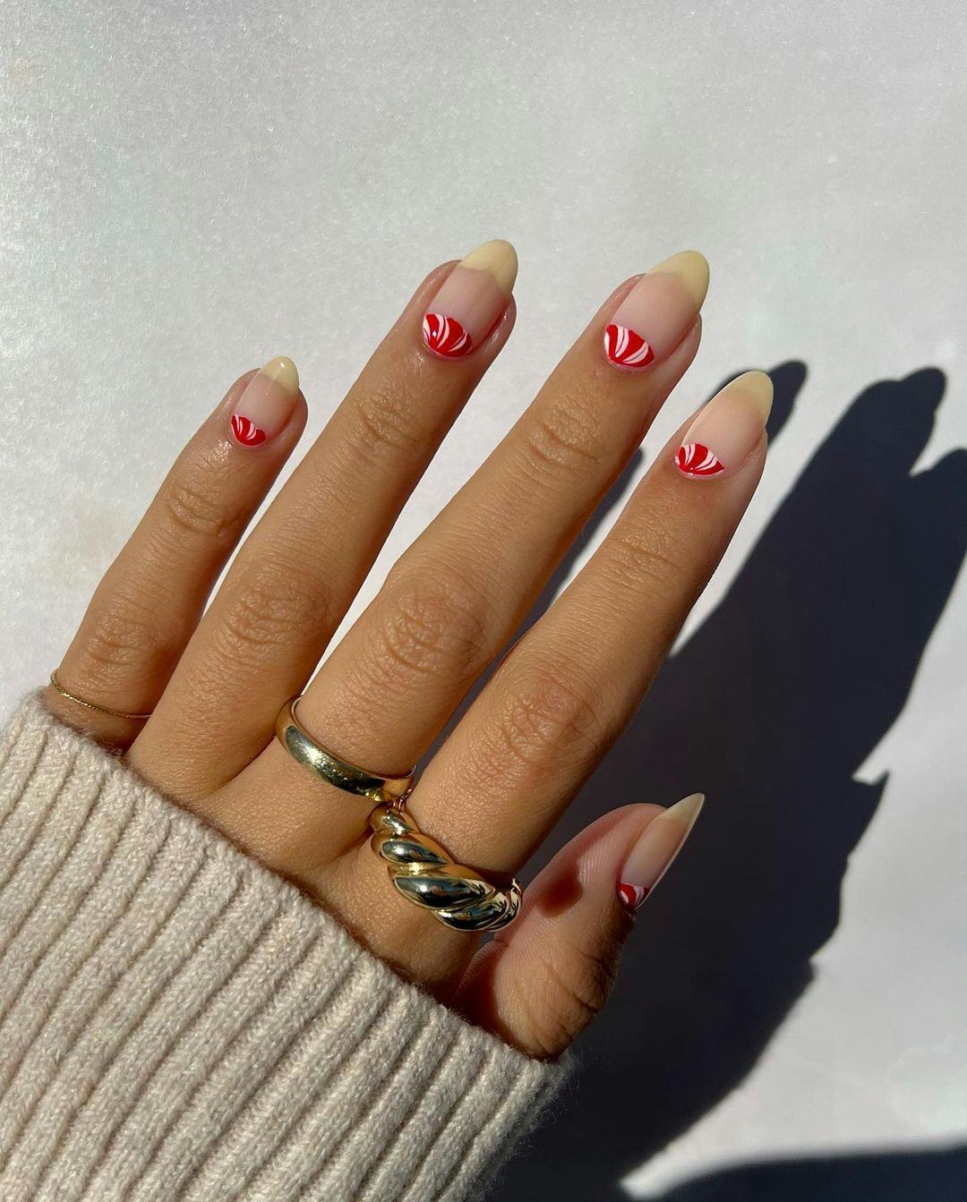 For a simple Christmas nail design for the 2023 holiday season, a peppermint half moon manicure is f&hellip;