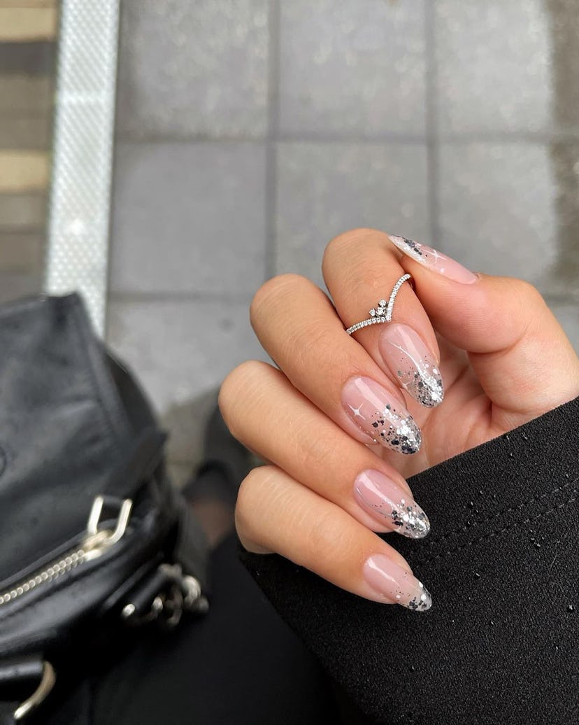For a simple Christmas nail design for the 2023 holiday season, silver ombre nails are minimal & eas...
