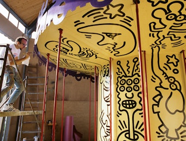 Keith Haring at work on his carousel.