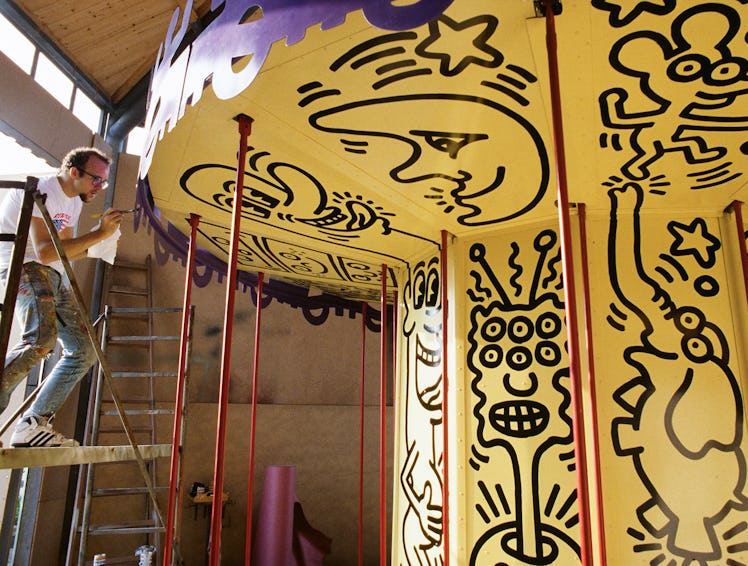 Keith Haring at work on his carousel.