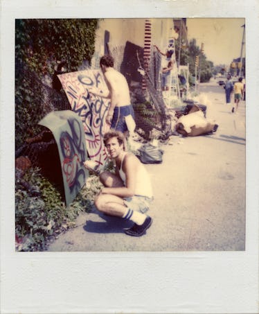 Kenny Scharf in front of the Bowery mural