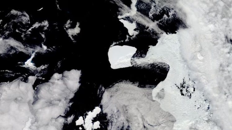 satellite photo of a large slab of ice in the ocean, passing the tip of peninsula