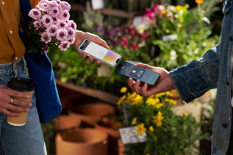 Tap to Pay on iPhone being used to buy flowers.