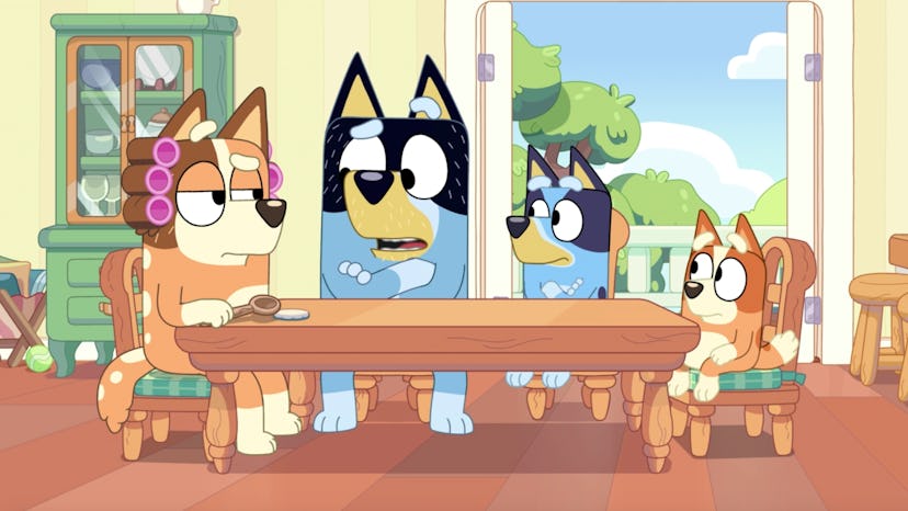 The Heeler family sits at the kitchen table in "Family Meeting"