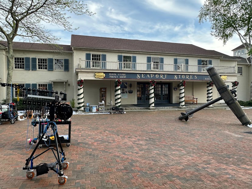 Filming gear can be seen in front of some of Mystic Seaport's quaint shops.