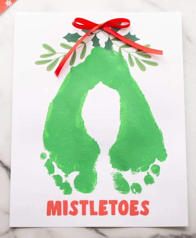 A baby footprint Christmas craft for baby's first christmas