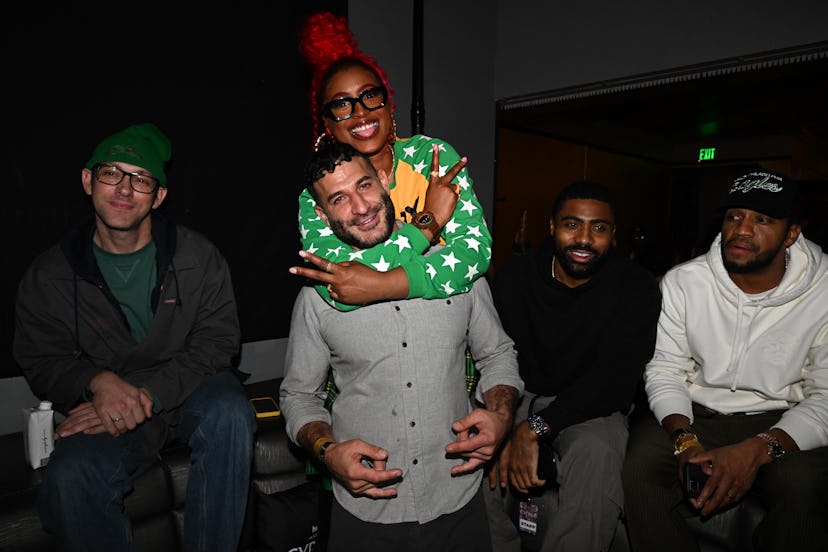 Tierra Whack, director Chris Moukarbel, and her team pose for photos at the L.A. 'Cypher' premiere.