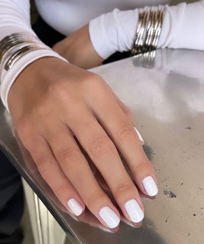 Tom Bachik paints Selena Gomez's natural-length nails in a "milk bath" white hue, which is trending ...