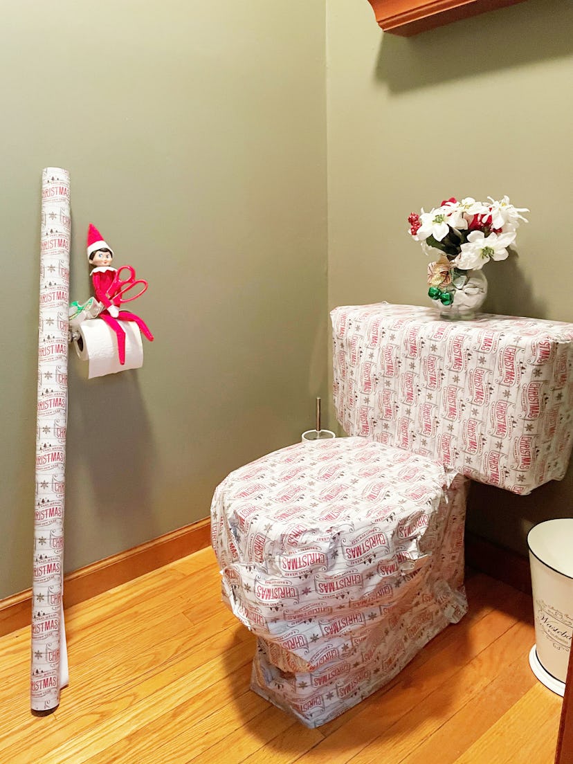 elf on the shelf mischievous ideaa; wrap the toilet with wrapping paper