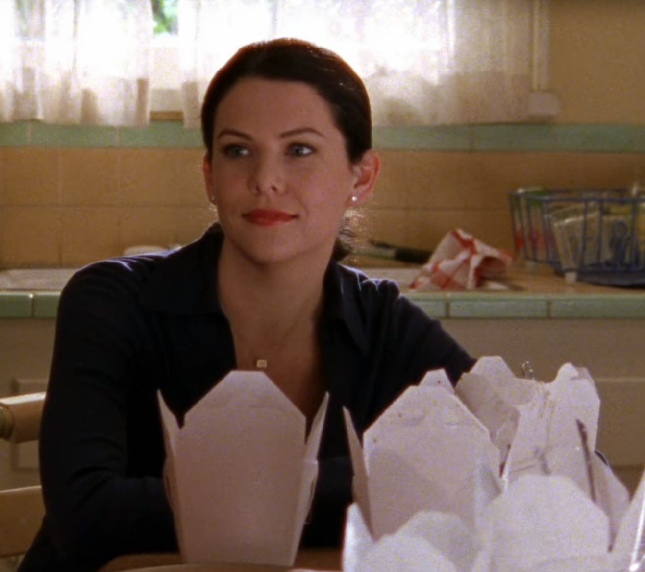 Lorelai on &lsquo;Gilmore Girls&rsquo; with Chinese takeout. Screenshot via Netflix