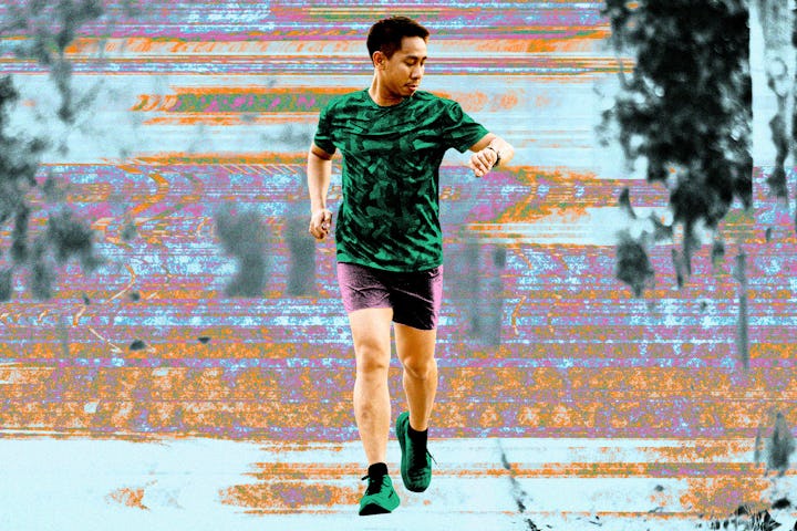 A man checking his stopwatch while doing 10-20-30 interval training.