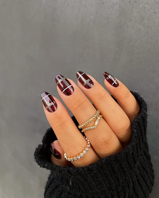 "Cherry mocha" plaid nails that match the cabincore aesthetic.