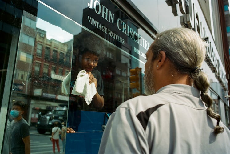 Man outside a vintage watch store in NYC