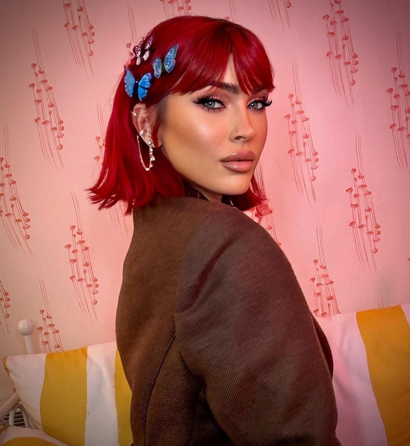 Megan Fox wore wispy bangs and oversized butterfly clips to promote her debut book, Pretty Boys Are …